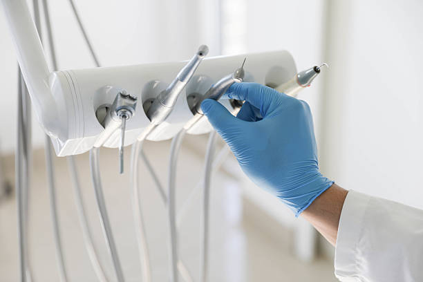 Professional Tooth Extraction technician working in Howard City, MI